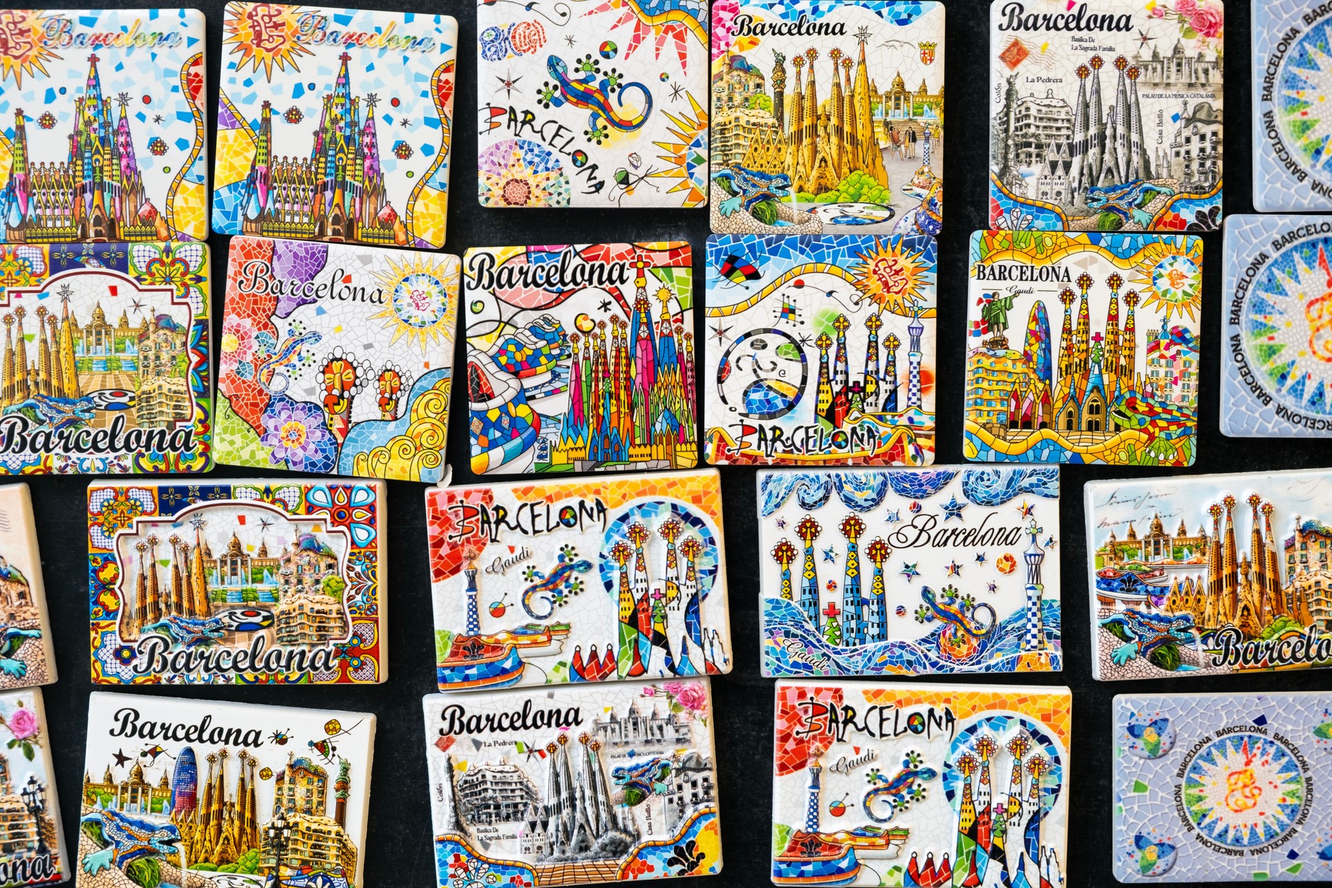 Vibrant refrigerator magnet souvenirs representing Barcelona